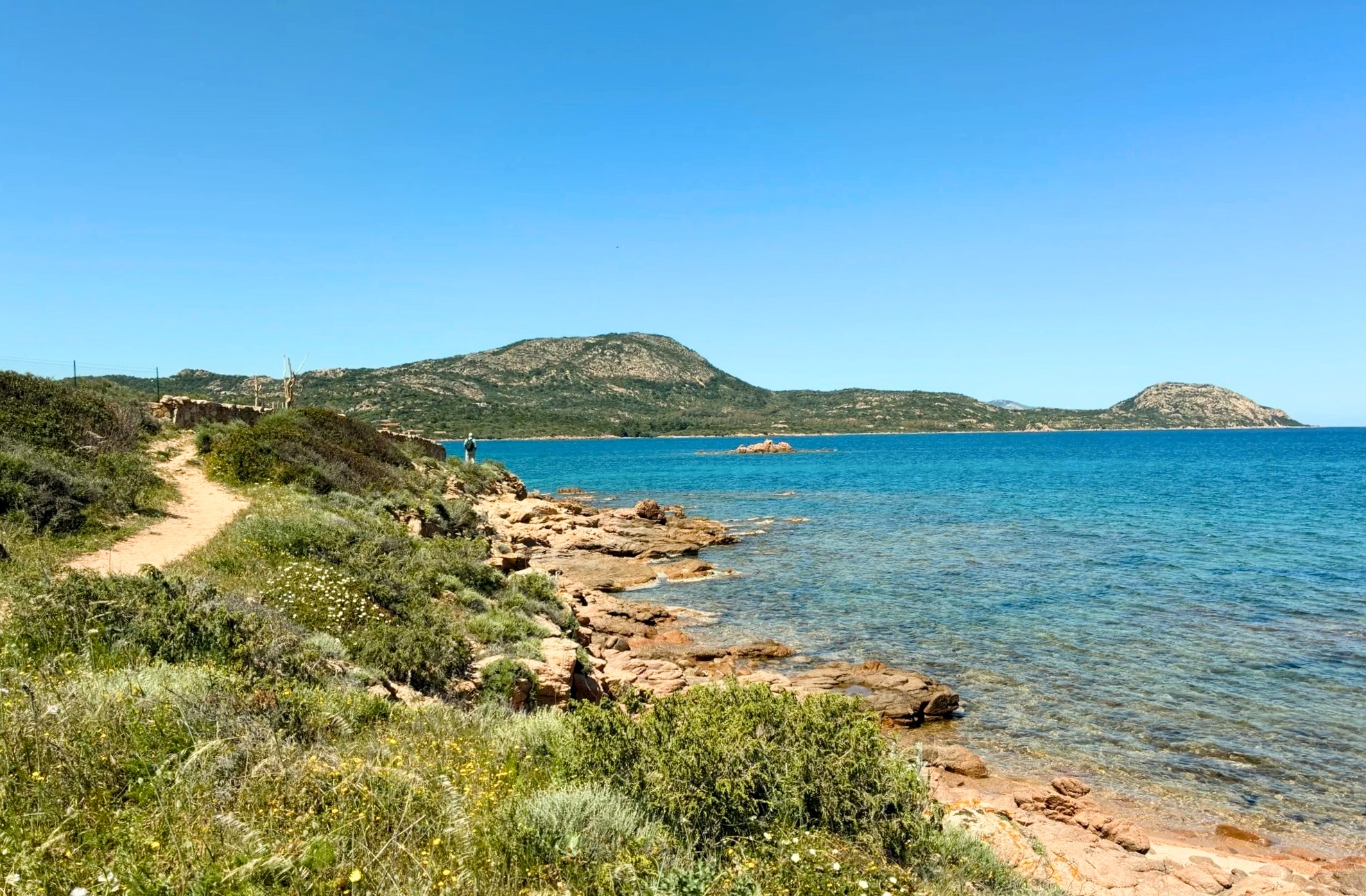 Shallow water and Tavolara view on the Porto Istana to Porto San Paolo coastal walk